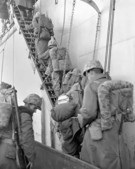 East Asia: U.S. Marines board a ship for evacuation from Hungnam