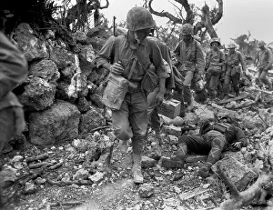 Offensives: U.S. Marines pass through a small village where