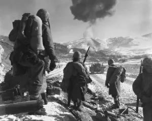 Corsairs: U.S. Marines pause at the roadblock on the way