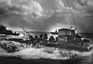 Forager: U.S. Marines ride ashore on Tinian Island in a