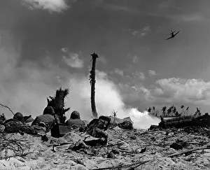 Eniwetok: U.S. Marines in the sand shoot across No Man's