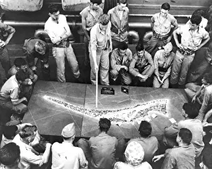 Hopping: U.S. Marines study a relief model of Tarawa Atoll