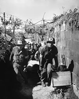 Corpsmen: U.S. Medics remove a casualty from the battle