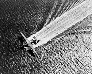Wakes: U.S. Navy Martin Mariner airplane landing on the