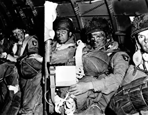 Blackened: U.S. paratroopers with blackened faces in a C-47