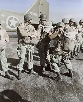 Equipped: U.S. paratroopers inspecting each others