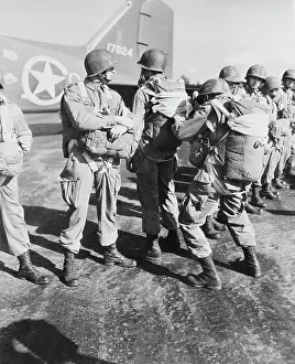 Inspecting: U.S. paratroopers inspecting each others