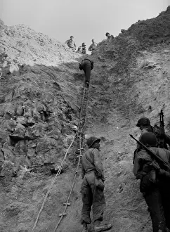 Lcgr1402: U.S. Rangers climb a cliff using a rope ladders