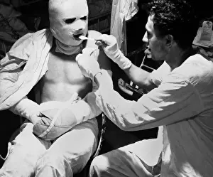 Helpless: U.S. sailor dressed in pressure bandages after