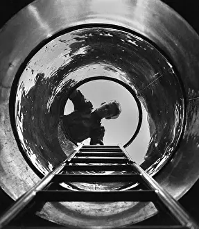 Submariner: U.S. sailor looks down the hatch the submarine
