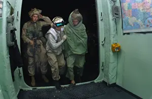 Pashtun: U.S. Sailor and a Marine bring a wounded ?