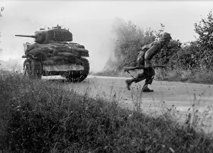 Cautiously: U.S. soldier crosses a road cautiously under the