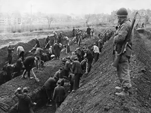 Anti Semitic: U.S. Soldier guards the reburial of concentration