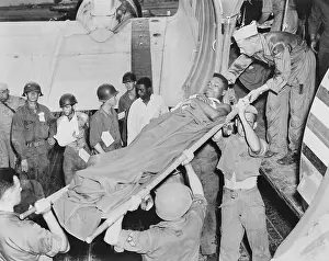 Medical Care: U.S. soldier is lifted from a Air Force C-47 in