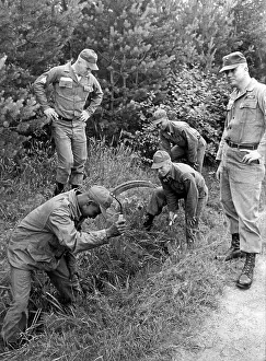 Sickles: U.S. soldiers during an agricultural training