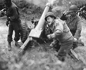 Consolidate: U.S. soldiers fire a 105-mm howitzer during the