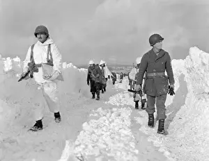 Plowed: U.S. soldiers patrol on a path plowed through