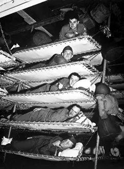 Bunks: U.S. soldiers in five tier bunks on Army troop