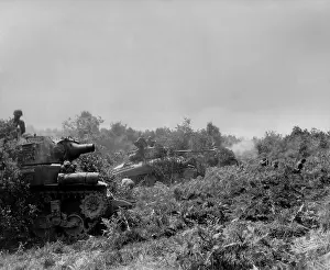 75mm: Three U.S tanks firing on German positions in