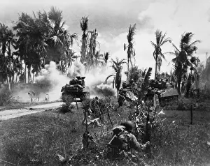 Lcgr1407: U.S. Troops take cover behind advancing tanks while