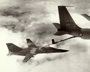 Refuels: A USAF General Dynamics F-111E 68-027 refuels