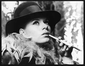 Smokes: USING CIGARETTE HOLDER