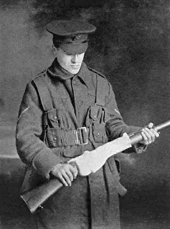 Upkeep: Using socks to keep rifles in working order, WW1
