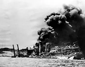Afire: The USS Shaw afire after a direct hit by ?