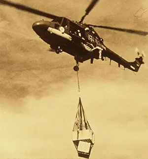 C1960s: Various helicopters lifting load