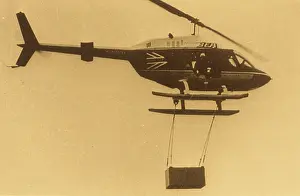 C1960s: Various helicopters lifting load