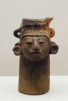 Dilatation: Vase decorated with human head. Ceramics, Zapotec culture