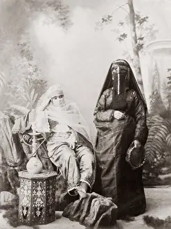 Veiled: Two veiled women hookah, Egypt, c.1890