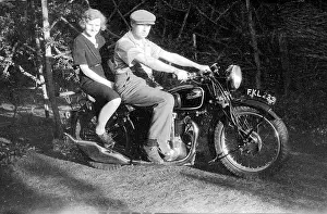 Biking: Velocette motorcycle with couple