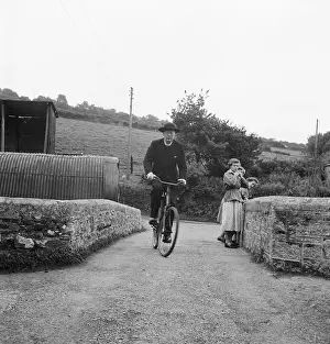 Vicars: Vicar riding a bicycle