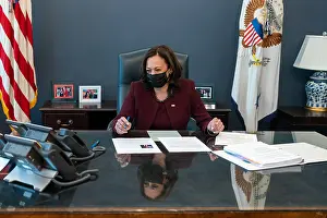 Reversal: Vice President Kamala Harris talks on a speaker