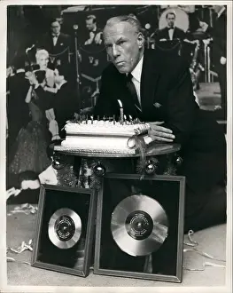 Platinum: Victor Silvester with platinum and silver discs, and cake