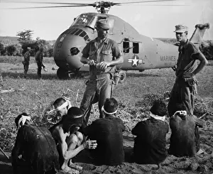 Quang: Six Viet Cong POWs. US Marines guard prisoners ?