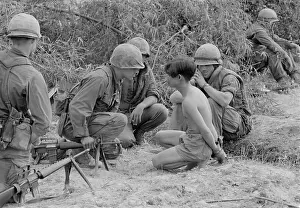 Quang: Viet Cong prisoner of war. US Marines interrogate ?
