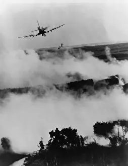 Fliers: Vietnam War bombing. Two bombs fall from ?