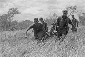 Leathernecks: Vietnam War. While under heavy fire, US ?