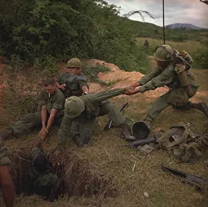 Quang: Vietnam War. A US infantryman is lowered ?