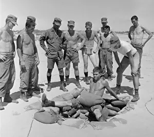 Foxhole: Vietnam War. US Marine Lieutenant instructs ?