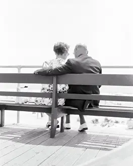 Retiree: Back View Affectionate Senior Retired Couple Sitting