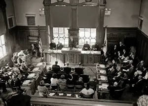 Councilmen: View From Balcony of Group of People Indoor in