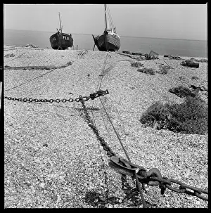Dungeness: A view along the beach towards a pair of fishing