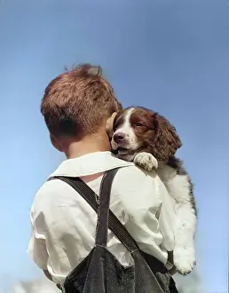 Mutt: Back View of Boy in Corduroy Overalls Holding
