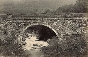 Foam: View of bridge and river, North Wales