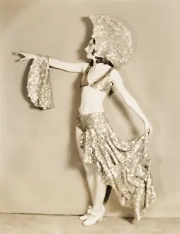 Sequins: Side view of dancer posing in sparkly costume