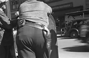 Sheriffs: Back view of a deputy sheriff with a gun ?