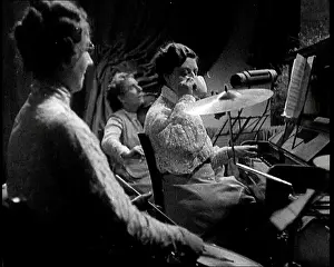 Sips: Side View of a Female Musical Group Playing